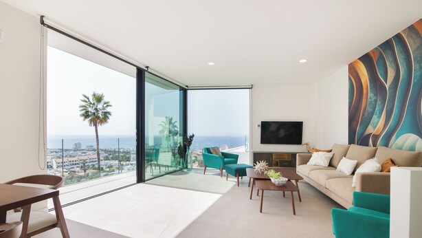 A modern living room with a sofa, chairs, a coffee table, and a TV. - Lux 200m NEW D Villa with heated pool, ocean view (Costa Adeje)