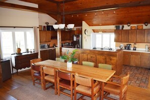Dining and kitchen - Morning Song | 4BR Waterfront • Pier • Screened Porch (Chincoteague Island)