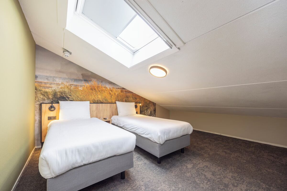 Drift off comfortably beneath skylights in a quiet loft.