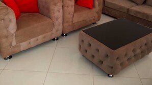 A living room with two sofas and a coffee table. - Island Inn  (Entebbe)