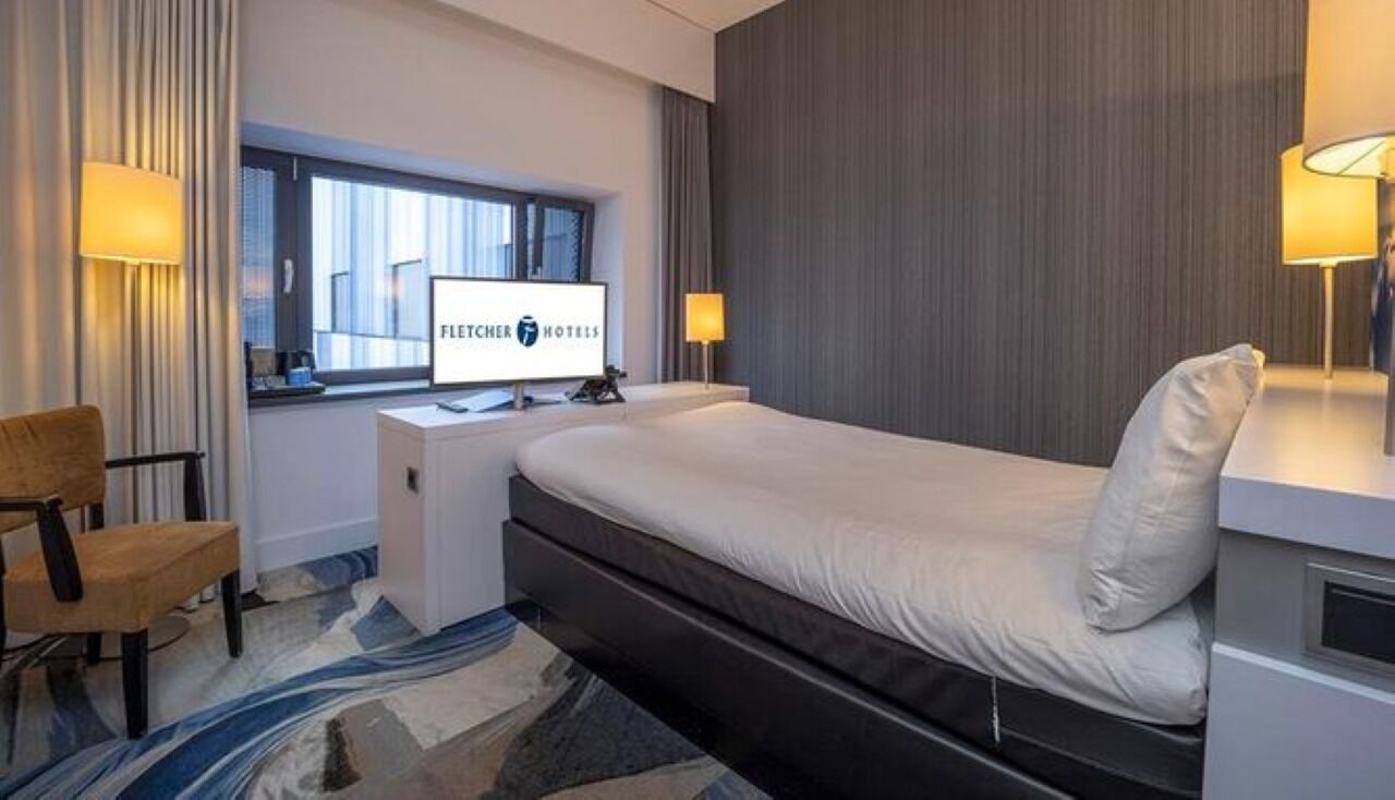 Relax into a peaceful night with warm lamps and plush bedding.