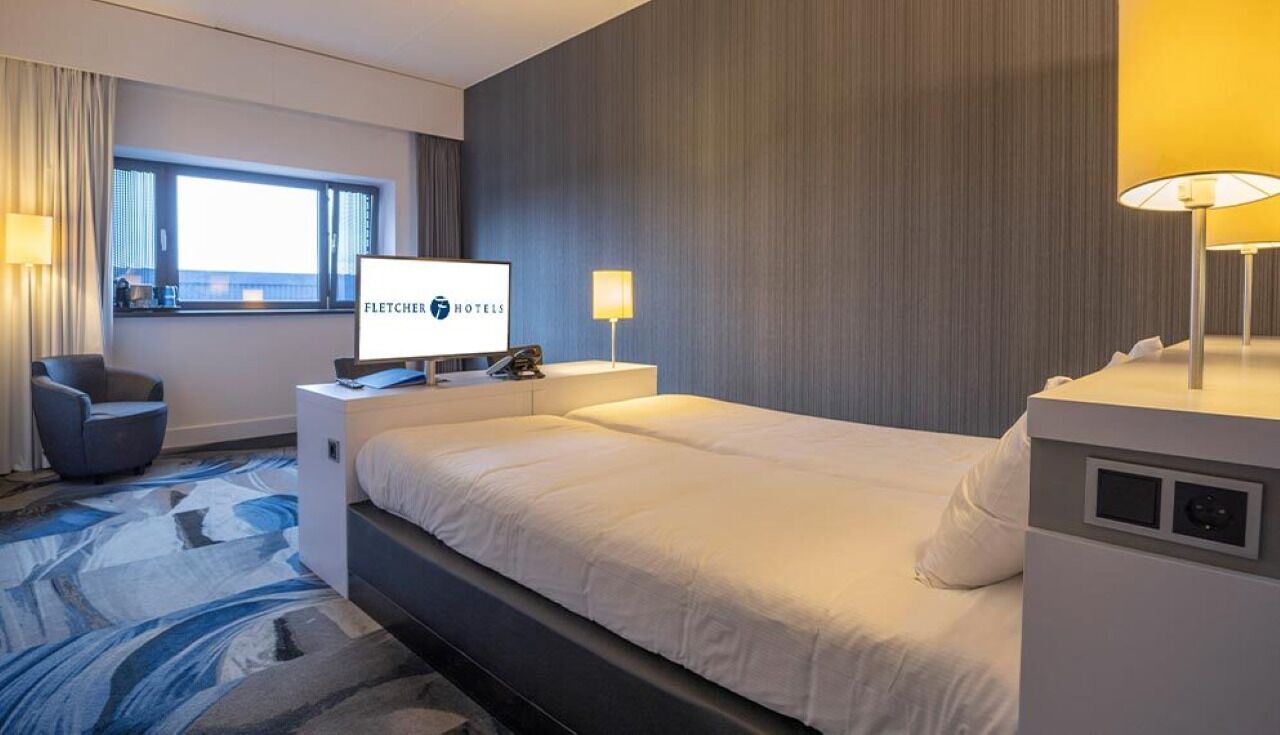 Unwind in a cozy, modern room with soft lighting.