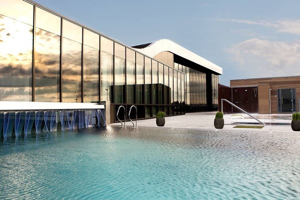 Dive into serene outdoor swims with sleek modern surroundings.