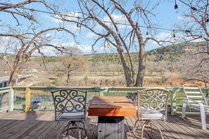 Outdoor dining - Guadalupe Riverfront Home | Decks, Firepit & Private River Access (Canyon Lake)