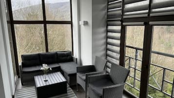 Suite, balcon | Coin séjour