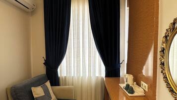 Superior trippelrum - utsikt mot staden | Vardagsrum