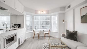 Cozy dining space perfect for enjoying meals, coffee, or planning your day in the city.