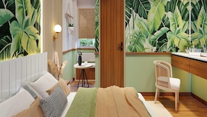 A bedroom with a bed, bedside table, and a chair. - Palette Hotel Millennium City Centre (Gurugram)