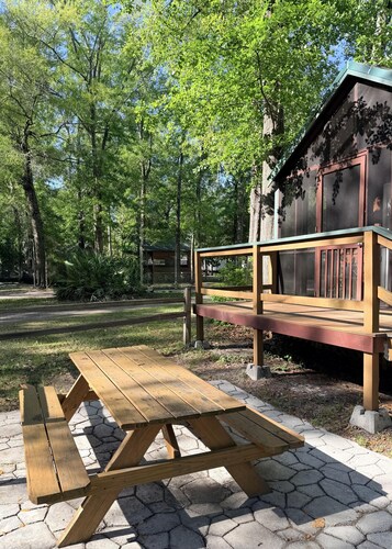 Deluxe Cabin - The Bear Den - Our Deluxe Cabins offer comfort with a true Okefenokee feel. Climate controlled, private, and set in a quiet part of the campground.