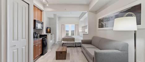 Desk, iron/ironing board, bed sheets