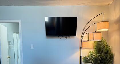 Comfortable Queen Room with a recliner in a Hotel