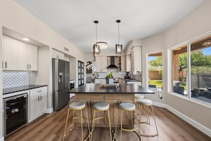 Full kitchen with 6 person bar seating open to outside and tv living room - Tranquil 4-Bedroom House in charming Cave Creek-Fresh Remodel (Cave Creek)