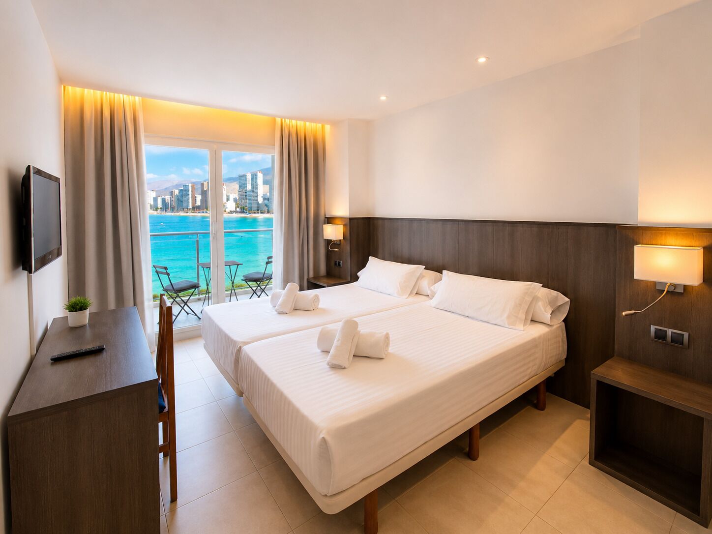 Room with small terrace and sea view | Premium bedding, desk, laptop workspace, blackout drapes