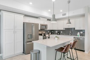 Fridge, microwave, oven, stovetop - Modern 2BR Condo with Lazy River Near Disney (Kissimmee)