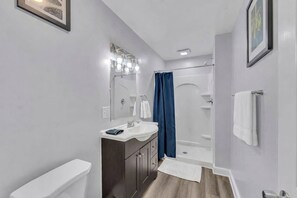 Shower, hair dryer, towels, shampoo