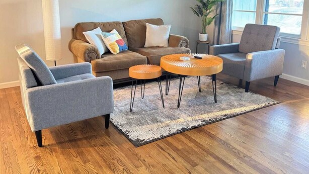 A living room with a sectional sofa, two armchairs, a coffee table, and a potted plant. - 🏡 Heart of Abilene – Charming 3-Bedroom, 1-Bath Home ✨<br><br>Enjoy a cozy and inviting stay in this 3-bedroom, 1-bath home, perfectly located near restaurants, shopping, and local attractions 🍽️🛍️. (Abilene)
