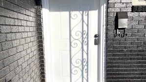 A white door with a decorative metal design, a mailbox, and a welcome mat. - 🏡 Spacious Stay on Bridge – 4BR / 2BA<br><br>Comfortable 4-bedroom, 2-bath home perfect for families or groups, with bright living areas, a full kitchen, and a convenient Abilene location. 🌟 (Abilene)
