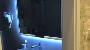 A bathroom with a white sink, a mirror with LED lighting, and a towel rack. - Vibehaus Center of Split City Only 400m From Beach (Split)