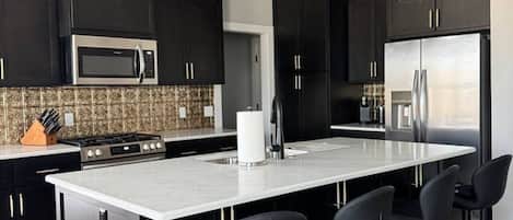 Coffee/tea maker, fridge, microwave, oven