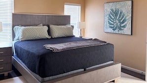A bedroom with a bed, ceiling fan, artwork, and a window. - `Live Like a Local, Stay Like a Guest` (Oklahoma City)