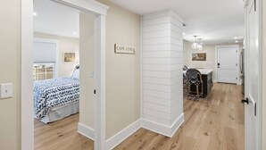 A modern interior with a bed, a dining area, and a kitchen.