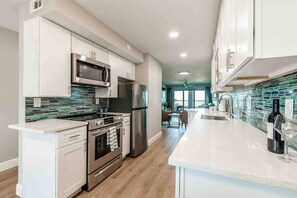 Fridge, microwave, oven, stovetop - Waterfront Updated Coastal Condo 2 Bed/2 bath (Clearwater)