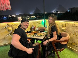 Deluxe Double or Twin Room, Balcony, Mountain View | Outdoor dining - Farasha pyramids Hotel (Giza Governorate)