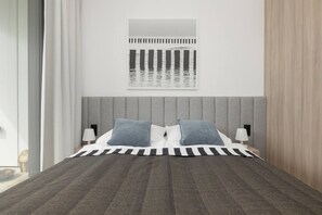 Une chambre à coucher moderne avec une tête de lit rembourrée de couleur grise, une couvre-lit à rayures, deux oreillers, des lampes de chevet et une œuvre d’art encadrée au-dessus du lit.