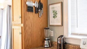 A kitchen with a wooden cabinet, a blender, a toaster, and a knife rack. - Scenic Views / Hike, kayak nearby / Dog friendly (Page County)