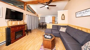 A living room with a fireplace, a television, a sofa, and a ceiling fan. - Scenic Views / Hike, kayak nearby / Dog friendly (Page County)