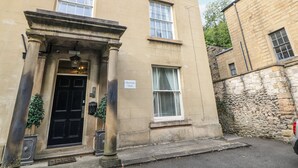 A building with a black door, columns, and a sign reading 'Derwent View'. - Riber (Matlock)