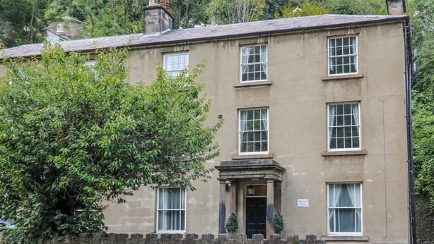 A two-story building with a stone facade, multiple windows, and a sign indicating 'Derwent View.' - Arkwright (Matlock)