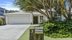 A residential house with a garage, a driveway, and a mailbox. - The Cabana Oasis, TOP NOTCH (WOORIM)