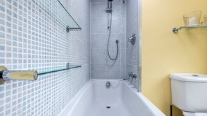 A bathroom with a bathtub, shower, and toilet. - The Fox at Hurley - The Warren Suite (Maidenhead)