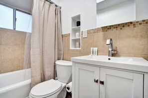 Shower, hair dryer, towels, shampoo