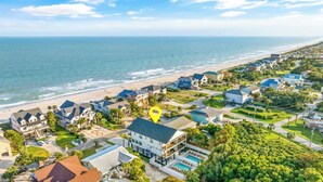 A coastal residential area with houses, a beach, and a large house with a pool. - Casa Blanca Sol Luxe Sea View House w Pool (Surfside Beach)