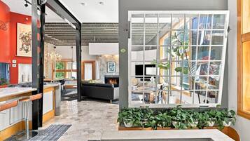 A modern interior with a kitchen, dining area, and living space.