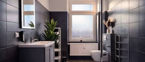 Family Apartment, Balcony, Garden View | Bathroom | Hair dryer, towels, soap, shampoo