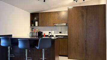 Fridge, microwave, stovetop, coffee/tea maker