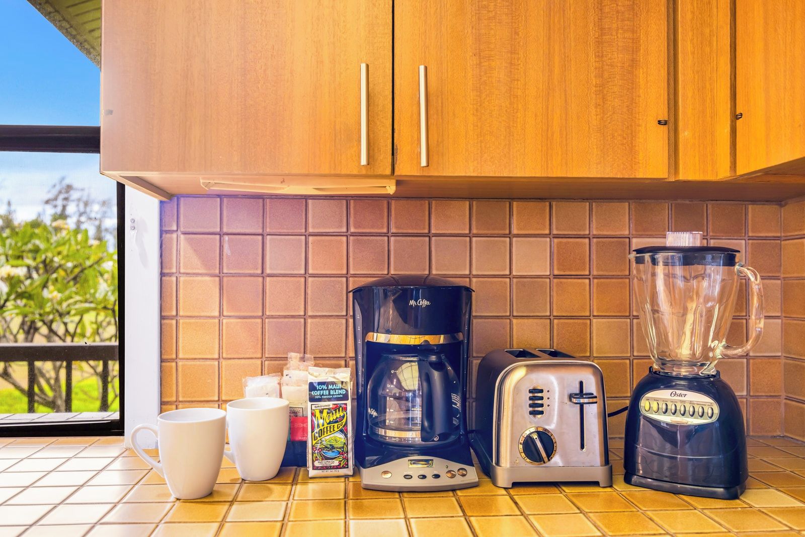 Start your day with fresh-brewed coffee in your well-stocked kitchen setup. Details like a blender, coffee maker, and thoughtful amenities add everyday ease. KRV-2121