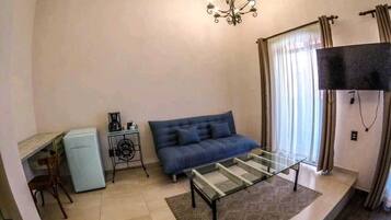 Habitación Deluxe, balcón, vista al parque | Área de sala de estar