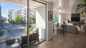 A modern apartment with a balcony, a dining area, and a living room. - Luxury Hollywood Condo, 2 King Suites, Pool (Los Angeles)
