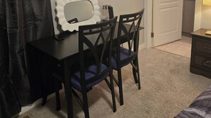 A bedroom with a desk, chair, and a bed. - Room-standard Bedroom With King Size bed (Lethbridge)