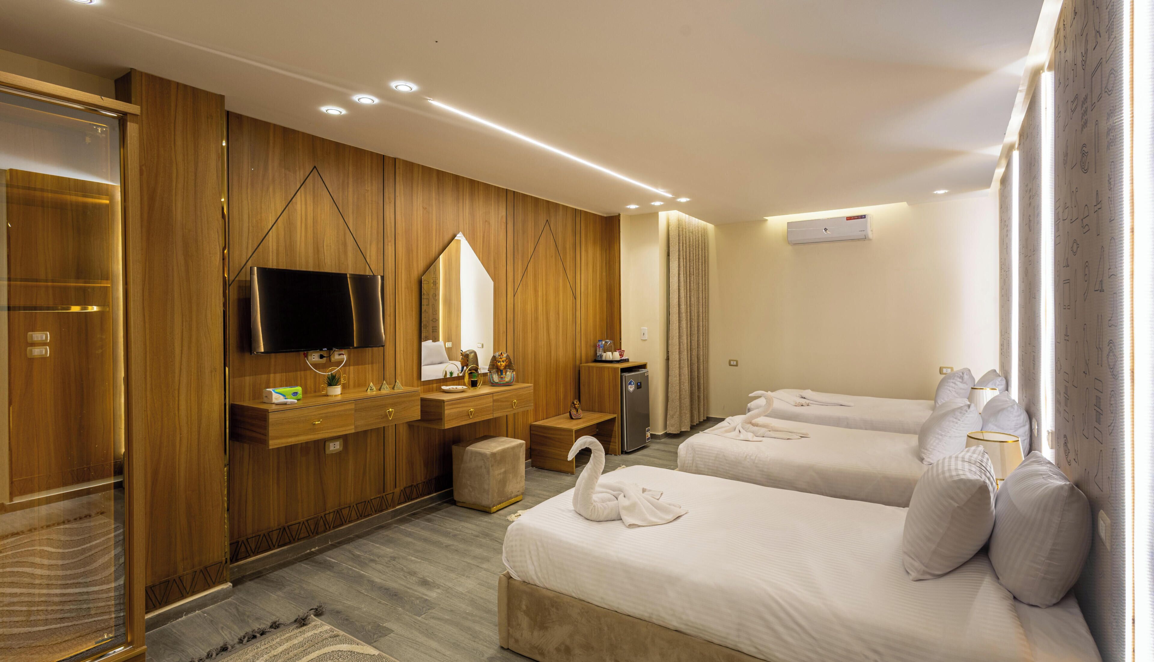 Habitación triple Confort | Ropa de cama