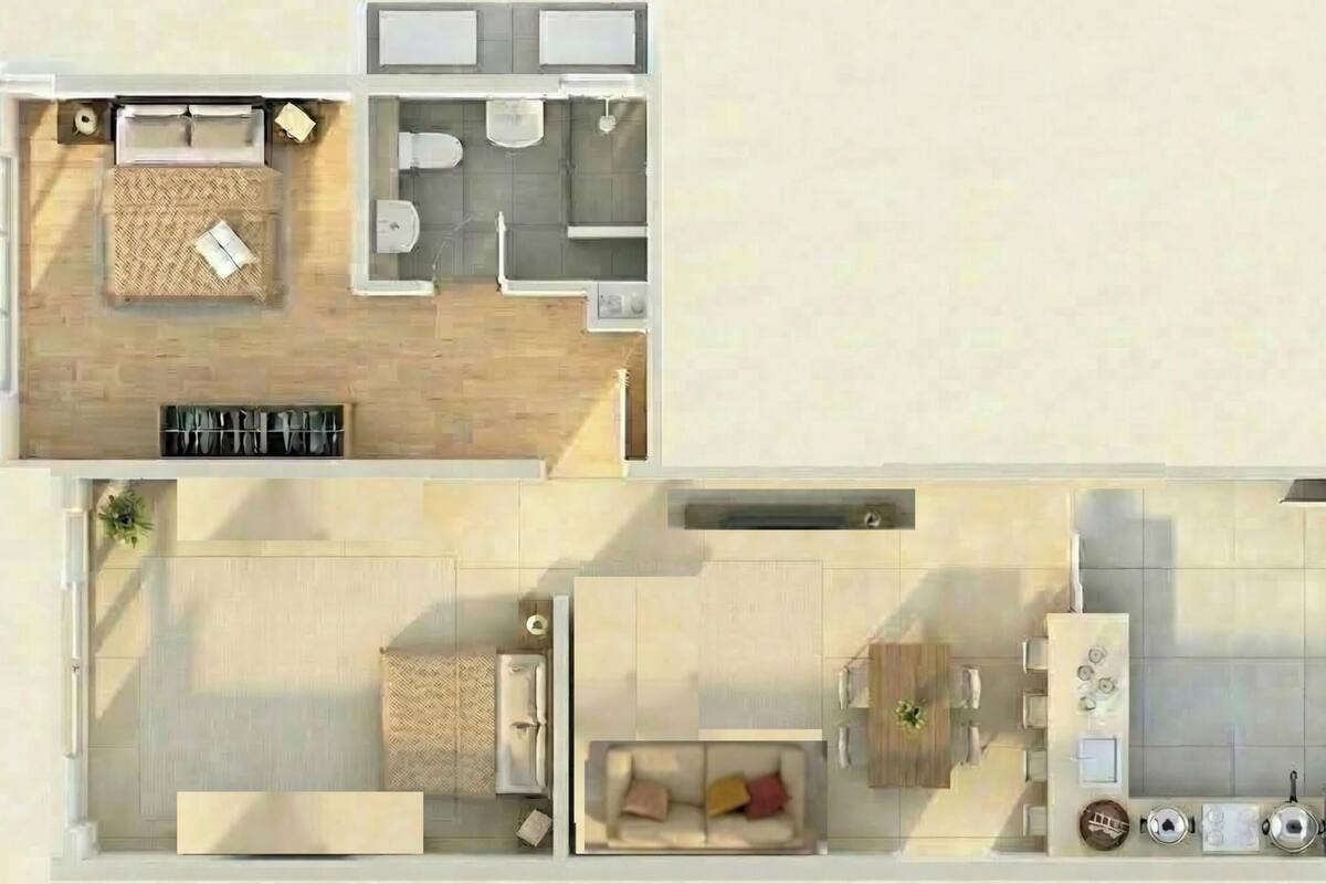 Un plan d’étage d’une chambre d’hôtel comprenant un espace de vie, une kitchenette, une salle de bain et un coin repas.