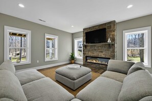 Fireside Lounge - A separate seating area with a stone fireplace gives the lower level a cozy gathering spot. - Lakefront Lake Anna, Boat Dock, Hot Tub, Movie Theatre (Bumpass)