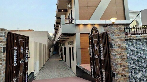 A building with a sign reading 'ASSI RETREAT' at the top. - Hotel Assi Retreat (Varanasi)