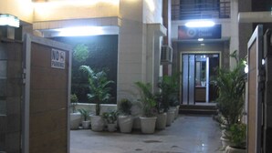 A hotel lobby with a 'NO PARKING' sign, potted plants, and a 'Park Classic' sign above the entrance. - Posh Classic, sector 45, millenium city centre, gurugram (Gurugram)
