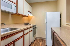 Fridge, microwave, stovetop, dining tables