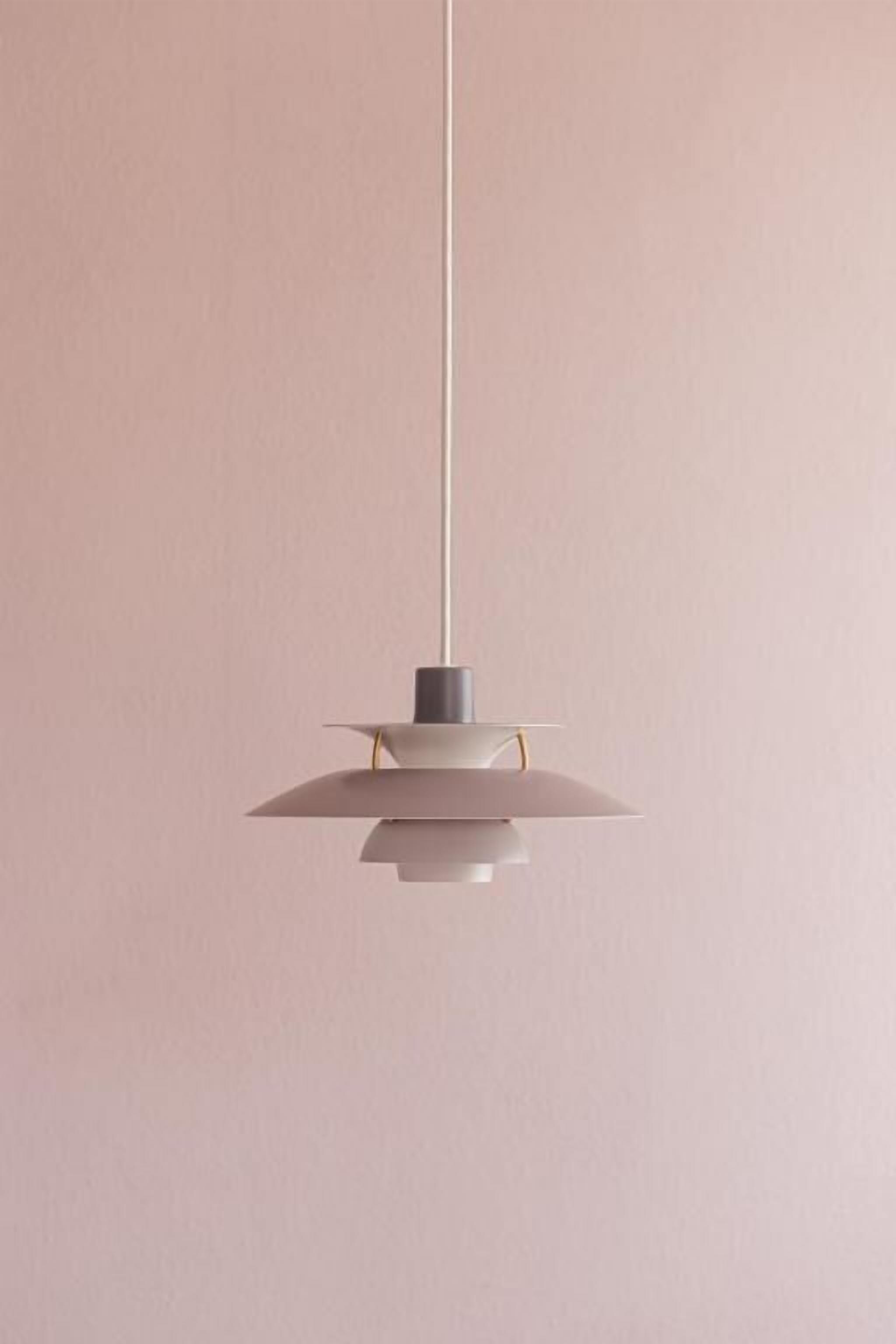 A pendant light fixture with a minimalist design, hanging from a ceiling.